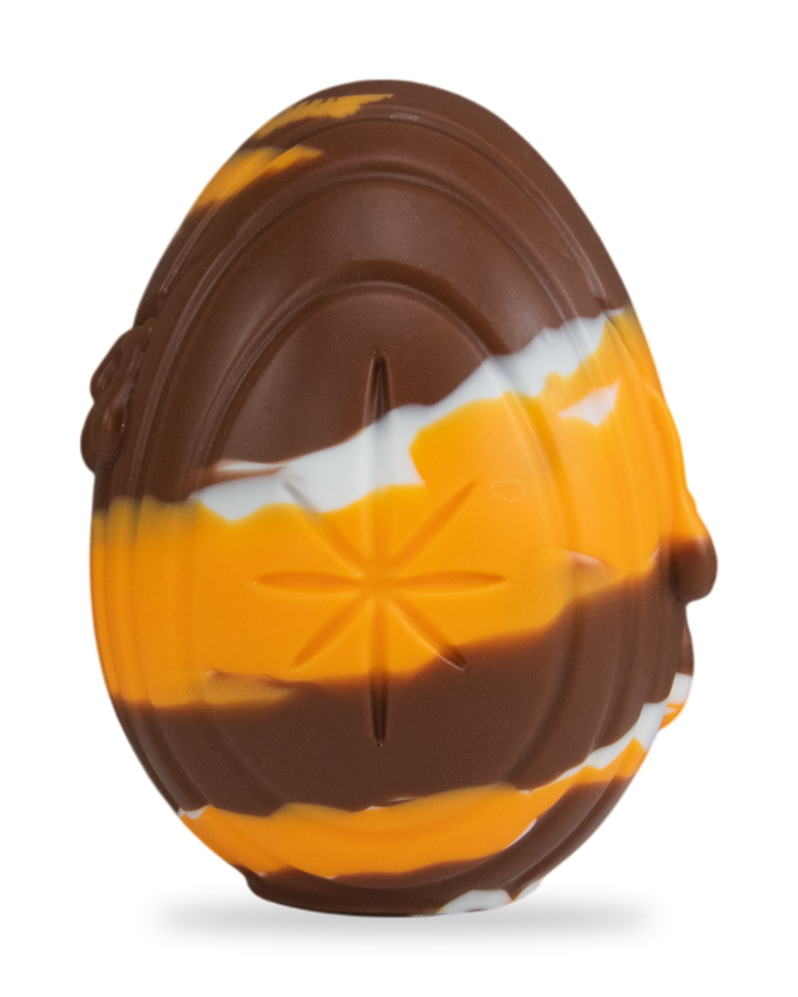 brown, orange and white Cream Egg, showing vertical grooves and moulded drips.