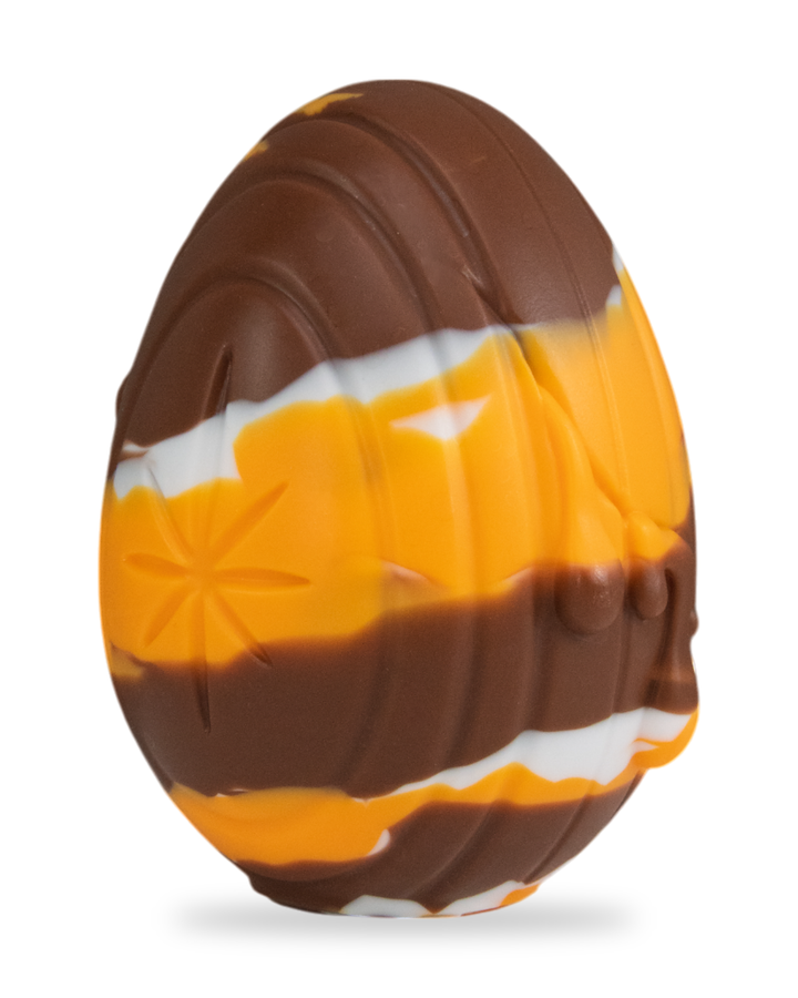 brown, orange and white Cream Egg, showing vertical grooves and moulded drips.