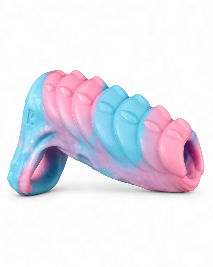 Angled side view of a pink-and-blue marbled silicone sleeve with raised ridges, an integrated loop and embossed Phreak logo, on a white background.