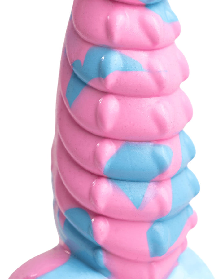 Close-up of Dovah’s layered dragon-inspired ridges and raised points in pink and blue silicone.