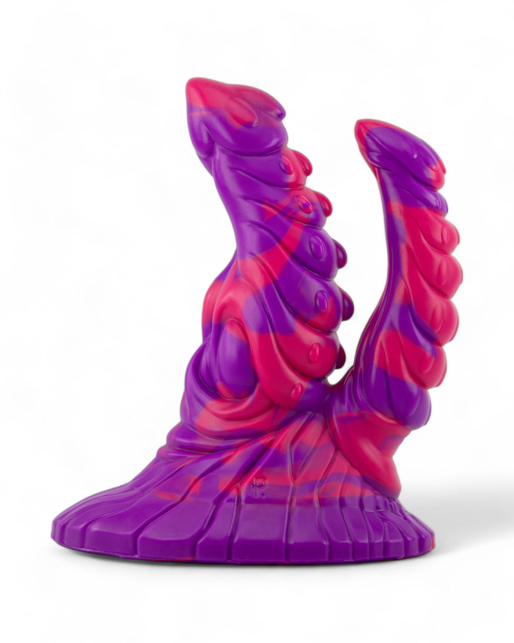 Purple and hot-pink Fenyx silicone toy with two sculpted shafts and a wide textured base, viewed at an angle on white.