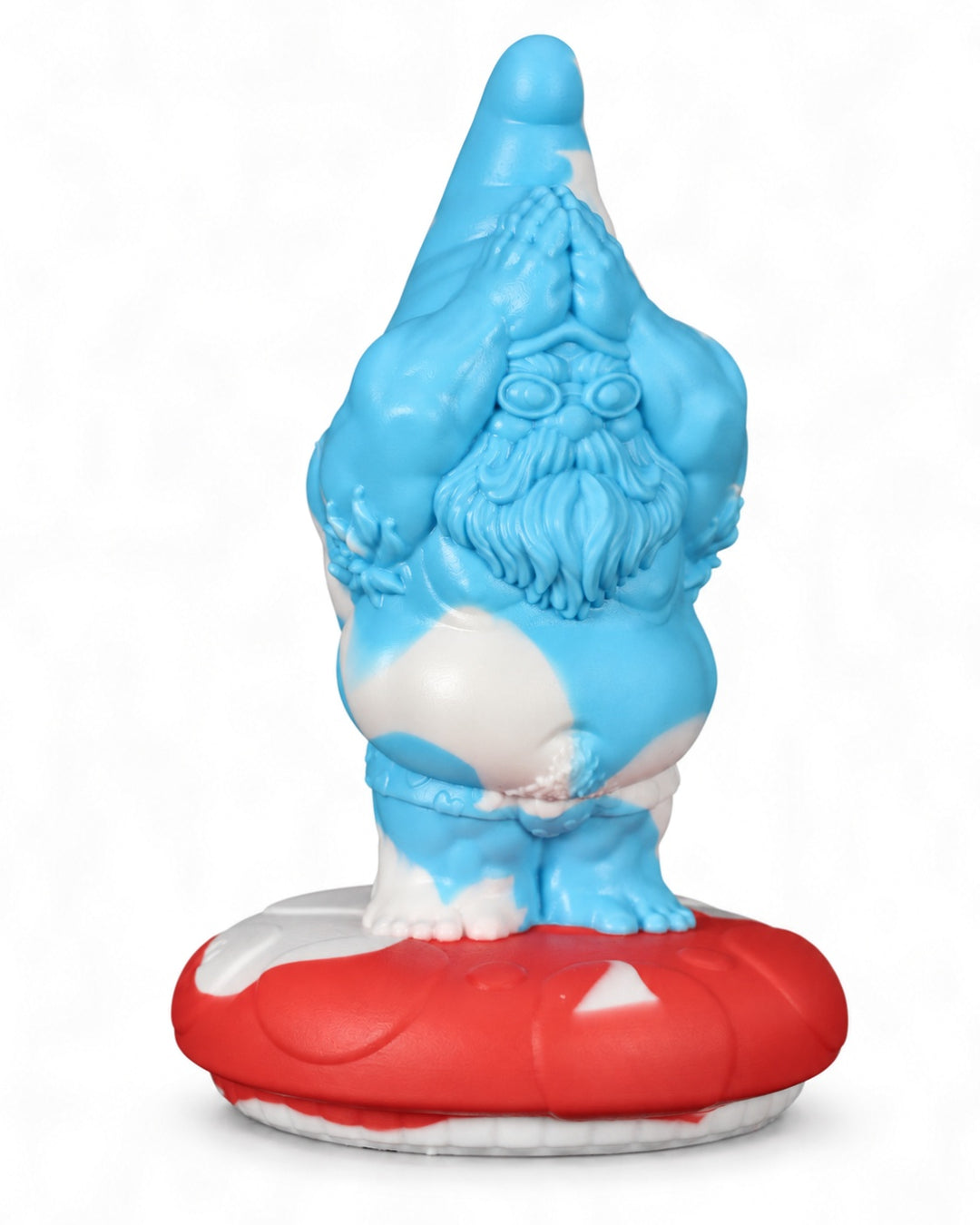 Angled view of the blue and white marbled Gnomey-Oh silicone toy on a red and white mushroom base, against a white background.