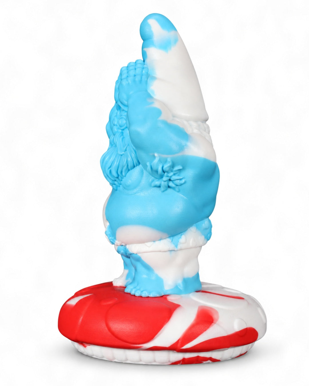 Side view of the blue and white marbled Gnomey-Oh silicone toy on a red and white mushroom base, against a white background.
