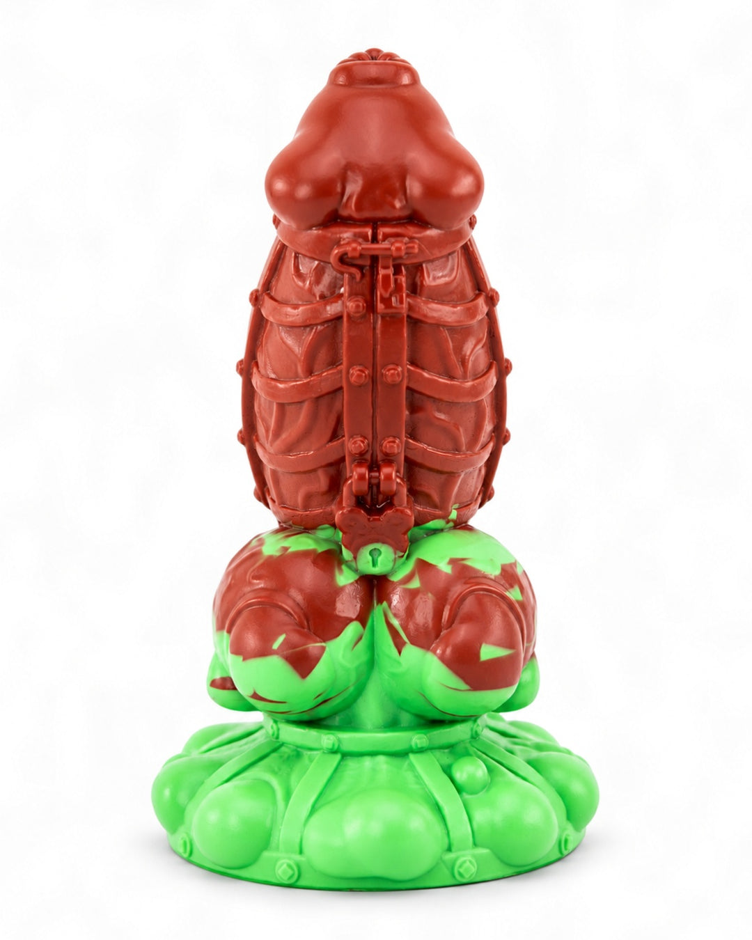 Front view of Kaige in red and mint-green silicone, showing sculpted cage straps, rivets and a central padlock detail.