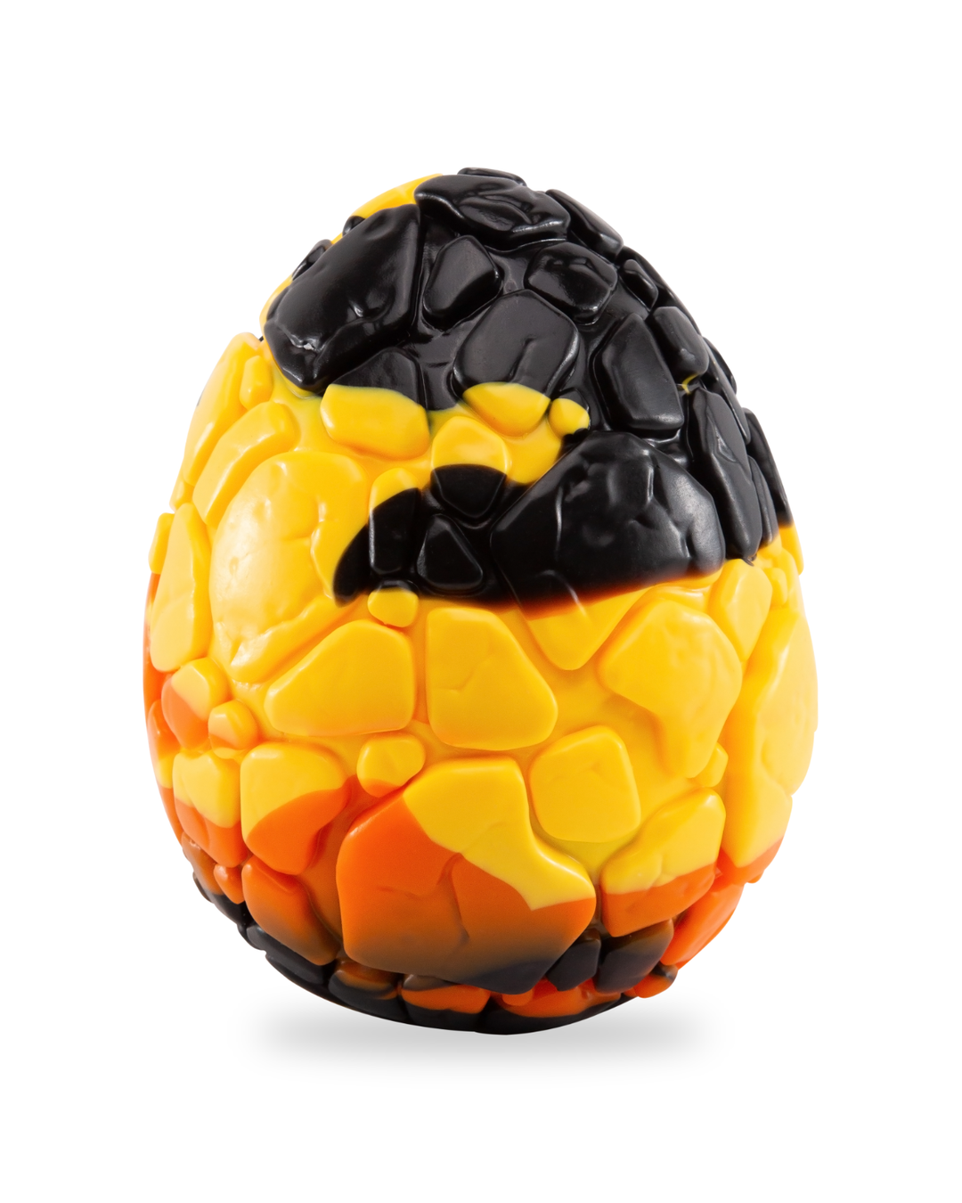 Black, yellow and orange Lava Egg silicone sculpture with raised rocky texture on a white background.