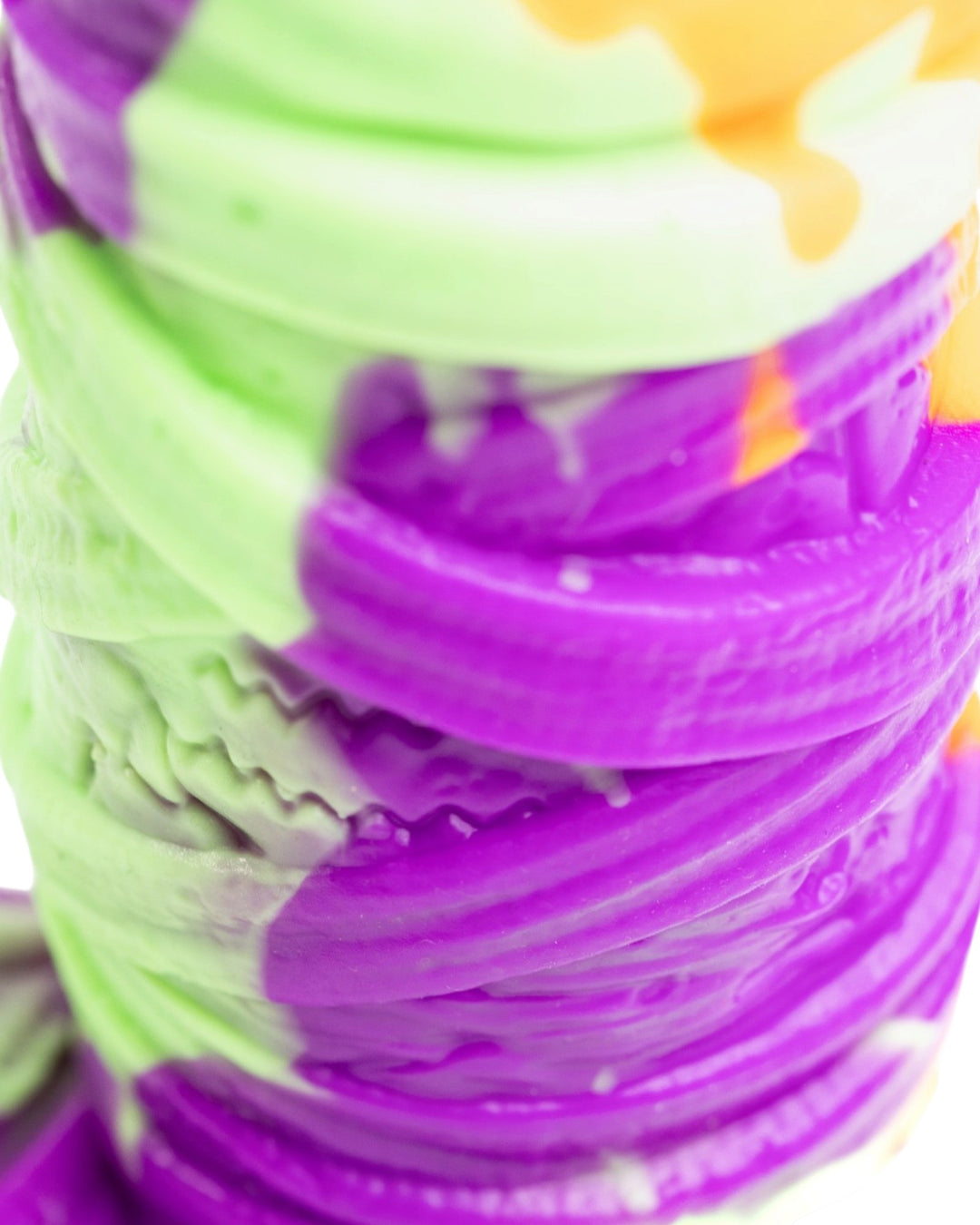 Close-up of purple and pale green bandages and recessed detailing on Phreak’s Mummy silicone toy.