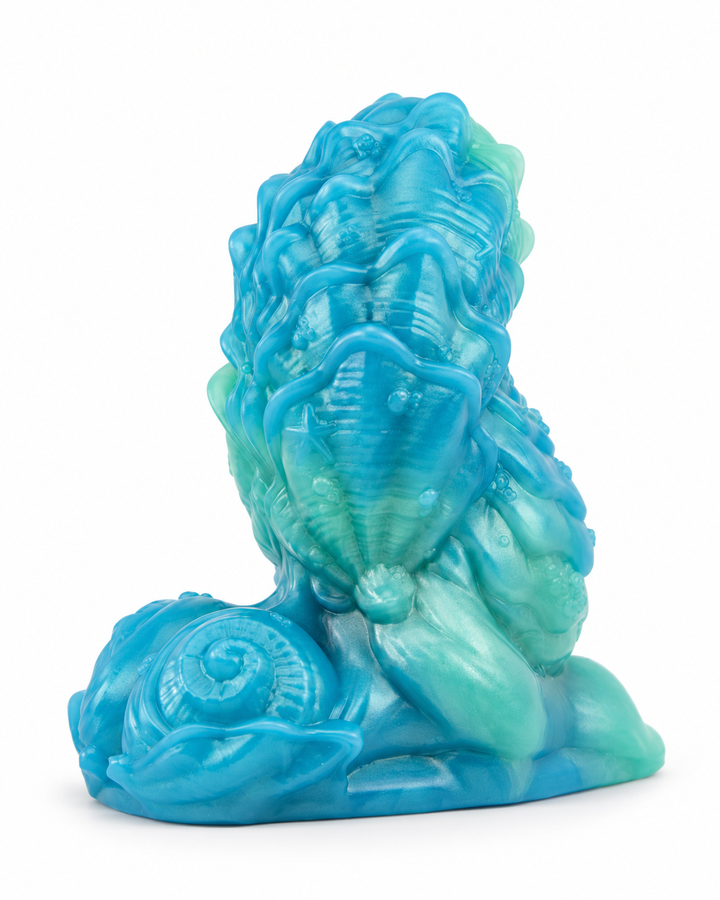 Blue and mint silicone fantasy toy with raised winding ridges, shell-like textures and a sculpted spiral base, on white with a soft shadow.