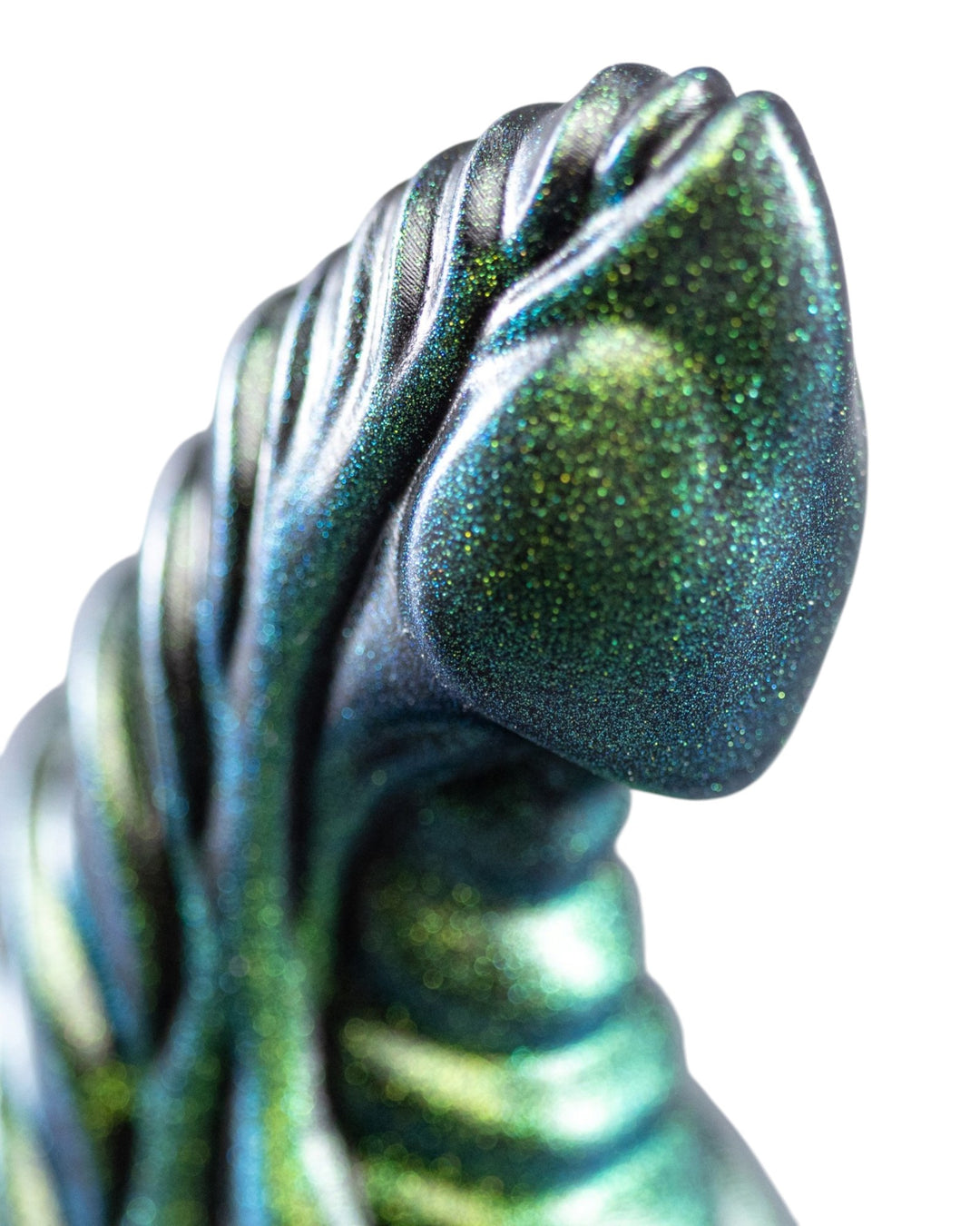 Close-up of the rounded tip and sweeping raised ridges on a metallic teal and green Phreak silicone toy.