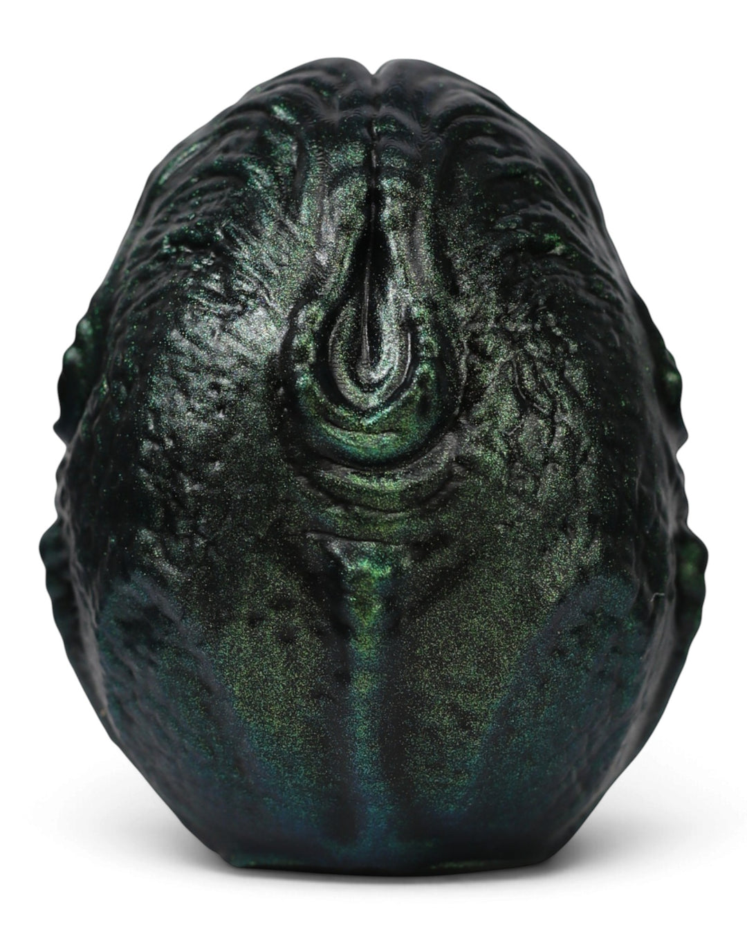 Alternate view of Weaver’s Ovomorph silicone egg, showing a central teardrop-shaped ridge and metallic green textured surface.