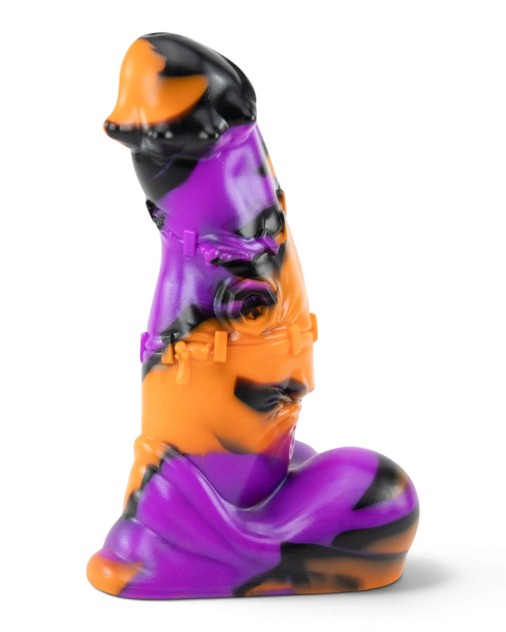 Side view of Brutenstein in orange, purple and black silicone, showing sculpted stitches, a bolt detail and flared base.