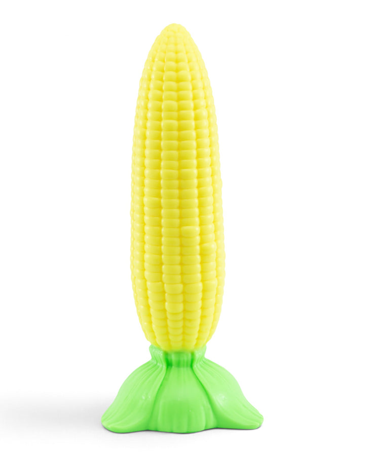 Front view of Phreak’s Corn on the Cob silicone toy showing rows of yellow kernels and a flared green leaf base on white.